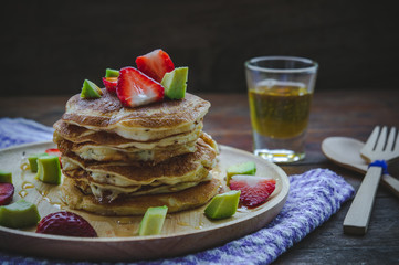 pancake strawberry avocado fruit and honey syrup sweet dessert on wood table pan cake dessert homemade