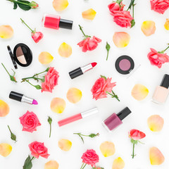 Fototapeta na wymiar Pattern of roses flowers, petals and feminine make up cosmetics on white background. Flat lay, top view.