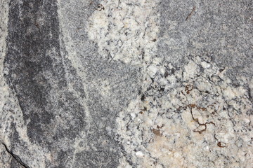 Granite background. Texture of gray granite stone. Natural pattern in gray tones. Abstract background