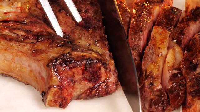 Slicing the delicious grilled beef steak