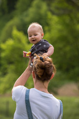 woman with baby  in nature