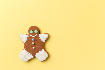 Christmas cookies on yellow background with copy space. Top view. Flat lay. Trendy colorful photo. Minimal style with colorful paper backdrop. Christmas concept