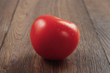 tomatoes on wooden background