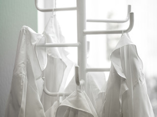 White lab dressings gown on a hanger