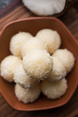 Coconut Sweet Laddoo OR Nariyal Ladduis a Popular Festival food from India. Served over moody background, selective focus