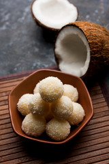 Coconut Sweet Laddoo OR Nariyal Ladduis a Popular Festival food from India. Served over moody background, selective focus