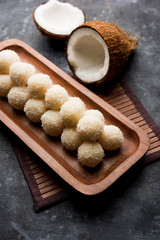 Coconut Sweet Laddoo OR Nariyal Ladduis a Popular Festival food from India. Served over moody background, selective focus
