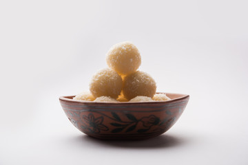 Coconut Sweet Laddoo OR Nariyal Ladduis a Popular Festival food from India. Served over moody background, selective focus