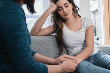 unhappy young woman share about her problem