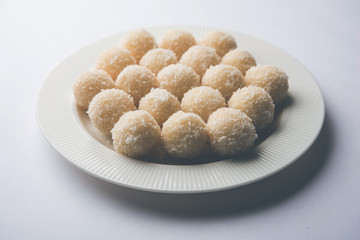Coconut Sweet Laddoo OR Nariyal Ladduis a Popular Festival food from India. Served over moody background, selective focus