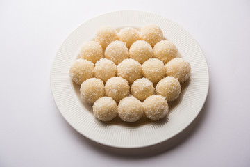 Coconut Sweet Laddoo OR Nariyal Ladduis a Popular Festival food from India. Served over moody background, selective focus