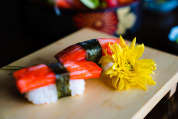 Traditional Japanese cuisine.Various kinds Sushi Set sashimi and sushi rolls. Fresh made Sushi set with salmon, prawns, wasabi and ginger in restaurant.Selective focus