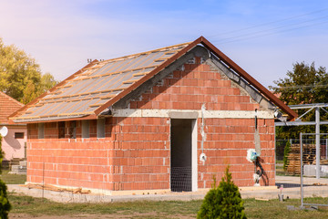 Construction of a small brick building.