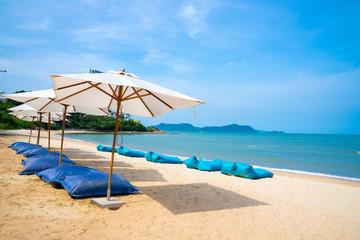 Blue chairs and Umbrella or tent  on beach lounge of hotel resort , Pattaya city, Chonburi,Thailand tropical countries.Vacation holidays background wallpaper concept