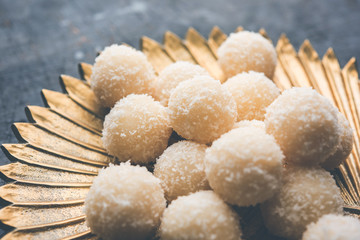 Coconut Sweet Laddoo OR Nariyal Ladduis a Popular Festival food from India. Served over moody background, selective focus