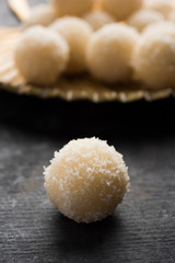 Coconut Sweet Laddoo OR Nariyal Ladduis a Popular Festival food from India. Served over moody background, selective focus