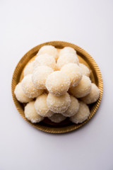 Coconut Sweet Laddoo OR Nariyal Ladduis a Popular Festival food from India. Served over moody background, selective focus