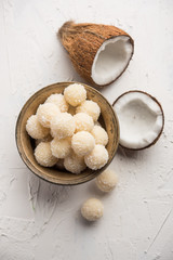 Coconut Sweet Laddoo OR Nariyal Ladduis a Popular Festival food from India. Served over moody background, selective focus