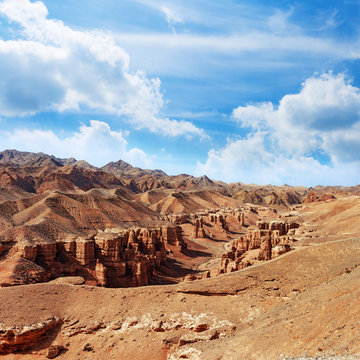 Charyn Canyon, a landmark of Kazakhstan. View of hills and mountains with cloudy sky. Natural landscape.