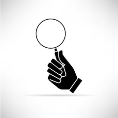 hand holding magnifier icon