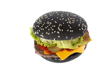 Black, charcoal bun hamburger on a white background
