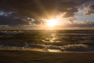 Fototapeta na wymiar storm on the sea during sunset