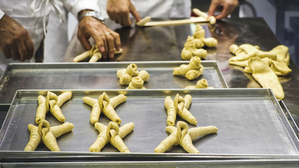 hands making bread in baker factory horn shape © Luca Lorenzelli