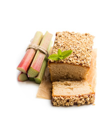 Homemade rhubarb cake topped with sweetened oats isolated on white