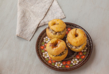 Baked apples with raisin, poppy seeds, rice and honey. Flat Lay