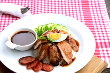 Barbecued red pork in sauce with rice..Thai Pork Menu.