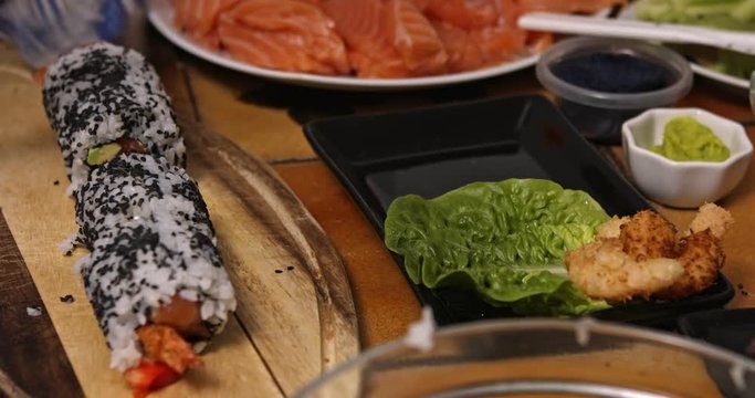Side view of cutting sushi roll