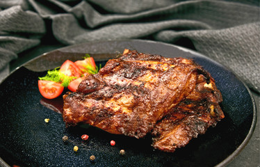 Barbecued Spareribs on black dish