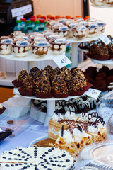 Variety of cakes on display at a market stall