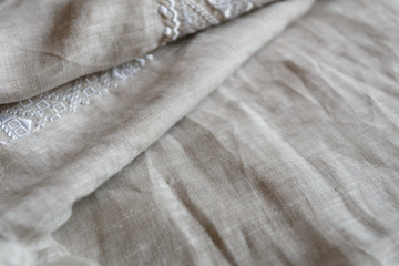 Embroidered linen shirt, white ornament, close