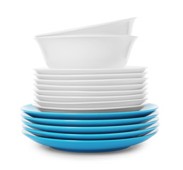 Stack of clean plates and bowls on white background. Washing dishes