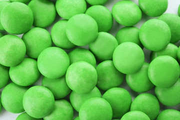 Many colorful candies as background, top view