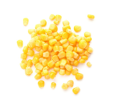 Tasty ripe corn kernels on white background, top view