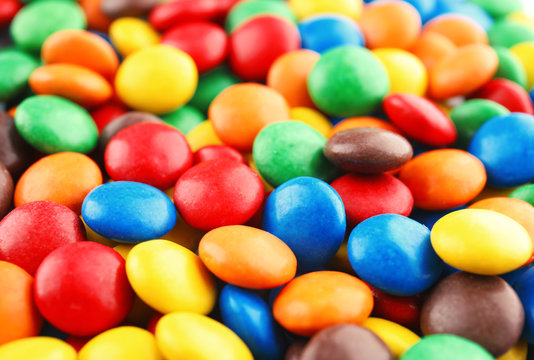 Many small colorful candies as background, closeup