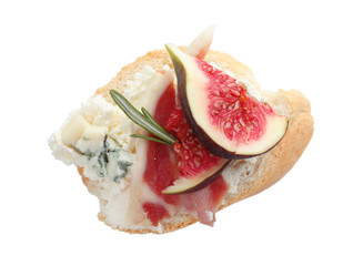 Sandwich with ripe fig, prosciutto and cream cheese on white background, top view