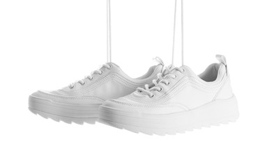 New stylish sneakers on white background. Trendy footwear