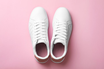 Pair of sneakers on color background, flat lay