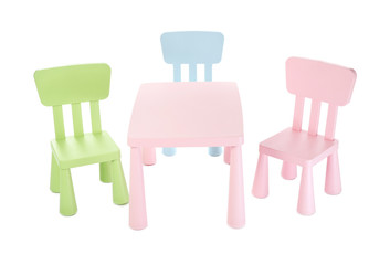 Colorful table and chairs for little kids isolated on white