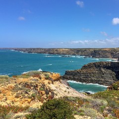 Fototapeta na wymiar seascape, sea view, rocks and waves of the Atlantic Ocean, top view of the sea, warm sunny day