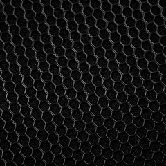 plastic black mesh with hexagonal cells on foam rubber, background