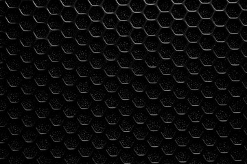 plastic black mesh with hexagonal cells on foam rubber, background