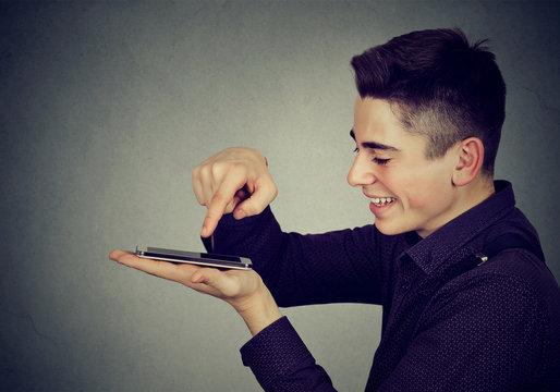 young happy man using smartphone