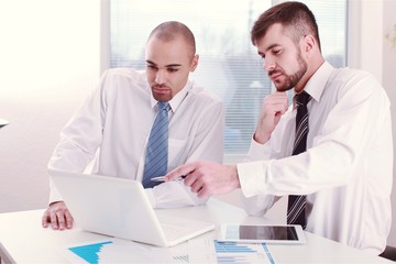 Fototapeta premium Young man and woman using laptop in