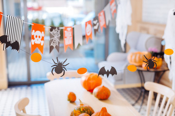 Table with pumpkins. Top view of celebration table with nice amazing carved pumpkins for Halloween party at home