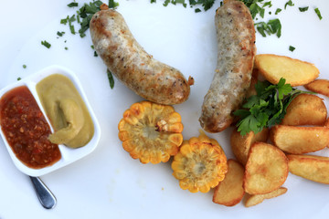 Sausages with vegetables and sauces
