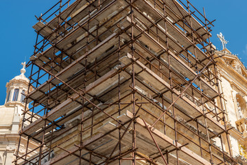 Construction scafold to restore church limestone.  Malta. horizontal.